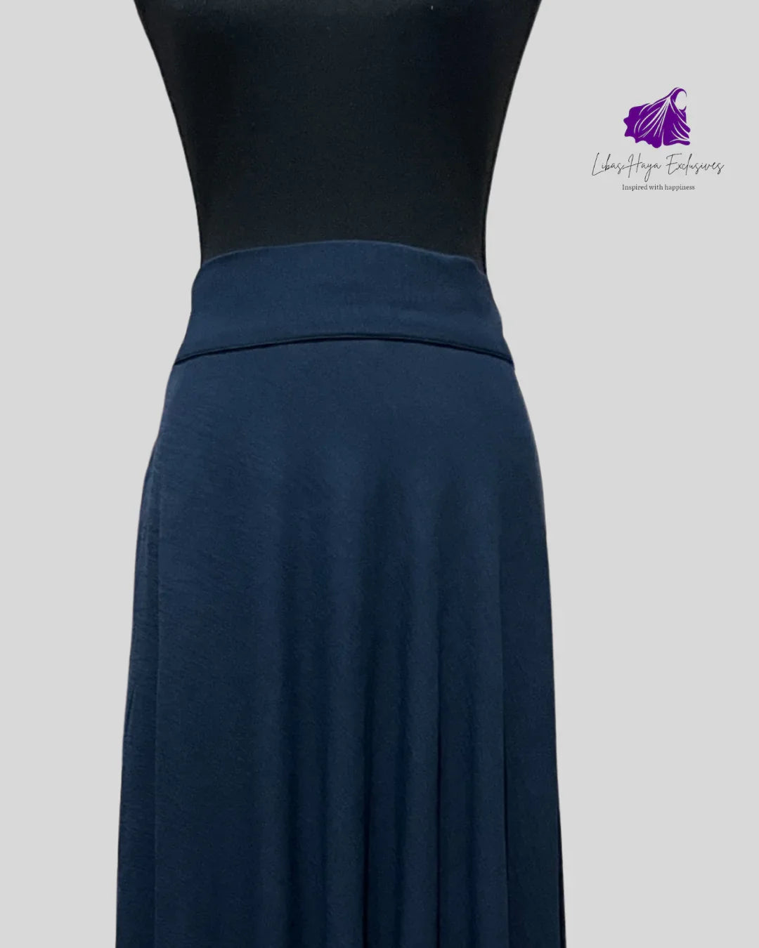 Navy blue skirt worn with wide waist band 