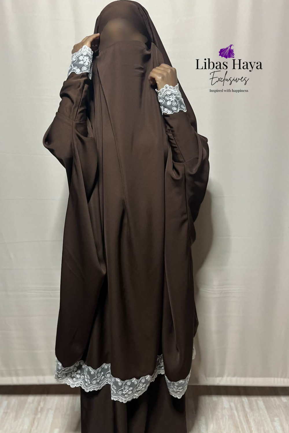 Brown jilbab with lace details on sleeves and hem, branded 'Libas Haya Exclusives