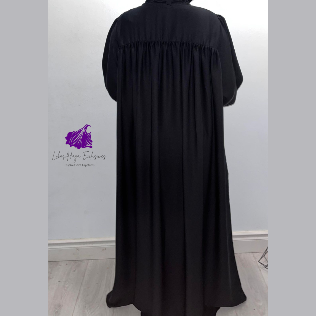 Abaya, Huda Uniform Abaya with gathered back and cuff sleeve in black. (Ships to North America)