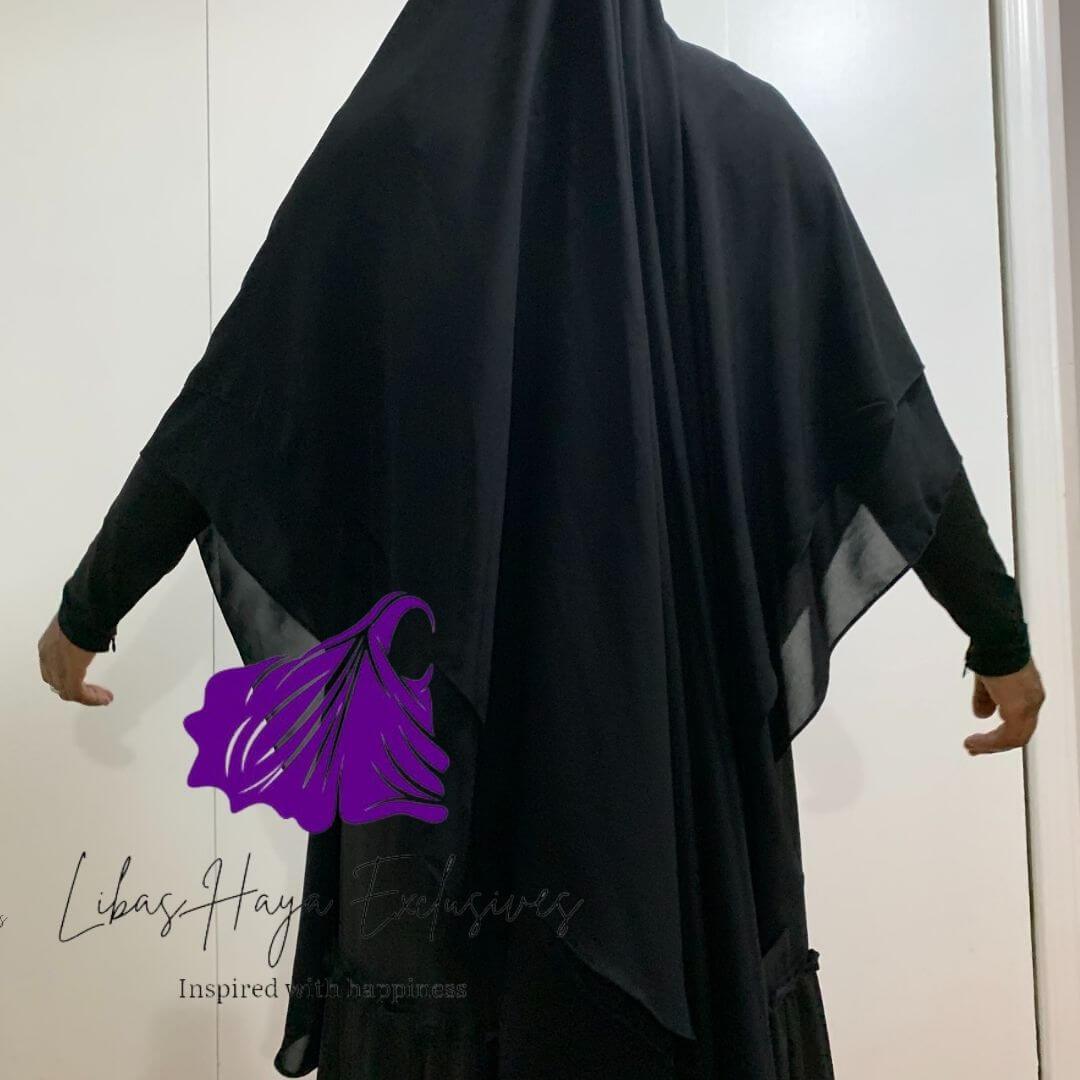 Our Aniqah Khimar is designed with functional features for you. Made as a two-in-one that easily converts from only being a khimar, to khimar plus niqab with an adjustable string at the back. Hands-free made with the sides shortened, just enough to give free hand movement, especially for prayer. finally, because we didn't comprise with comfort, this gorgeous long, double layer, ruffle khimar is made from our premium chiffon material , that is both breathable and soft.