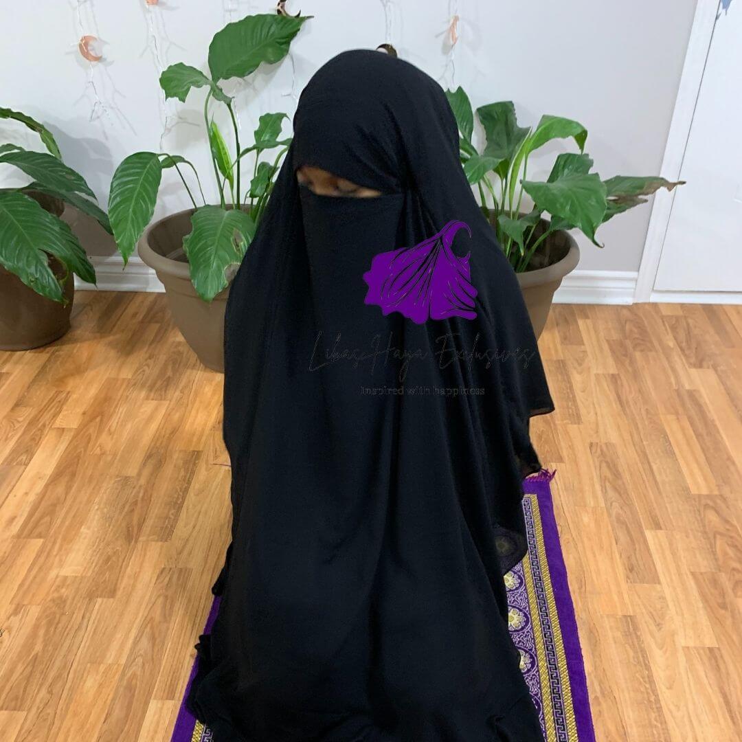 Apart from it's graceful look, Our Aniqah Khimar is designed with functional features for you.  Made as a two- in- one that easily converts from just a khimar, to a khimar plus niqaab, with adjustable strings at the back. Hands freed made shortened at the sides ,just enough to give hand movement, especially for prayer.  finally because we didn't compromise with comfort, this gorgeous long, double layer, ruffle khimar is made from our premium chiffon material that is both breathable and soft.