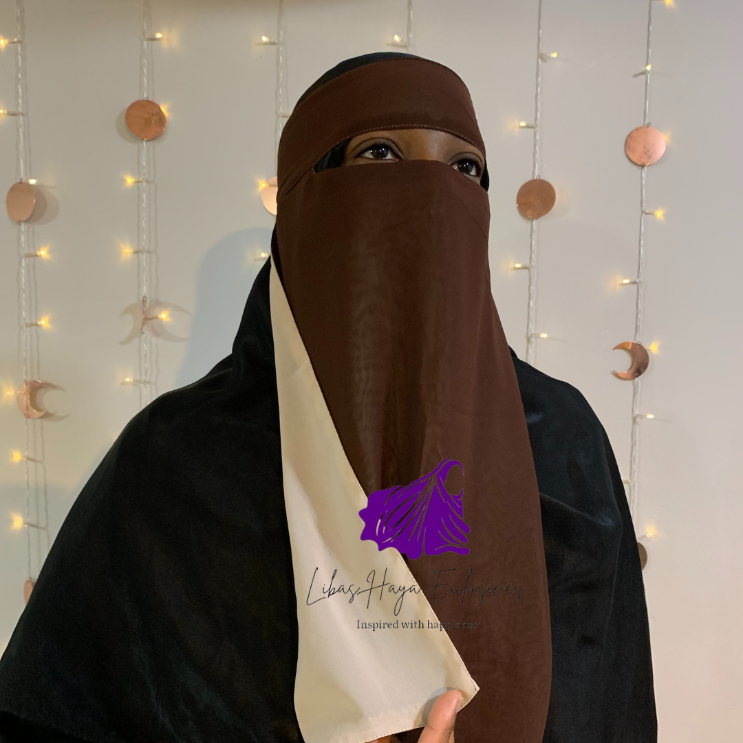 Our Raahah - Single piece Reversible Niqab, you didn't know you needed. Imagine having a niqab that gives you this: Less expense and Two colors, all in one! This niqab does just that!  With its design being two-in-one, you don't have to buy multiple niqabs to match your outfit. They are super soft, breathable, and lightweight. Each side having a solid color that is not visible on the other, making these a ''Staple piece'' niqab.