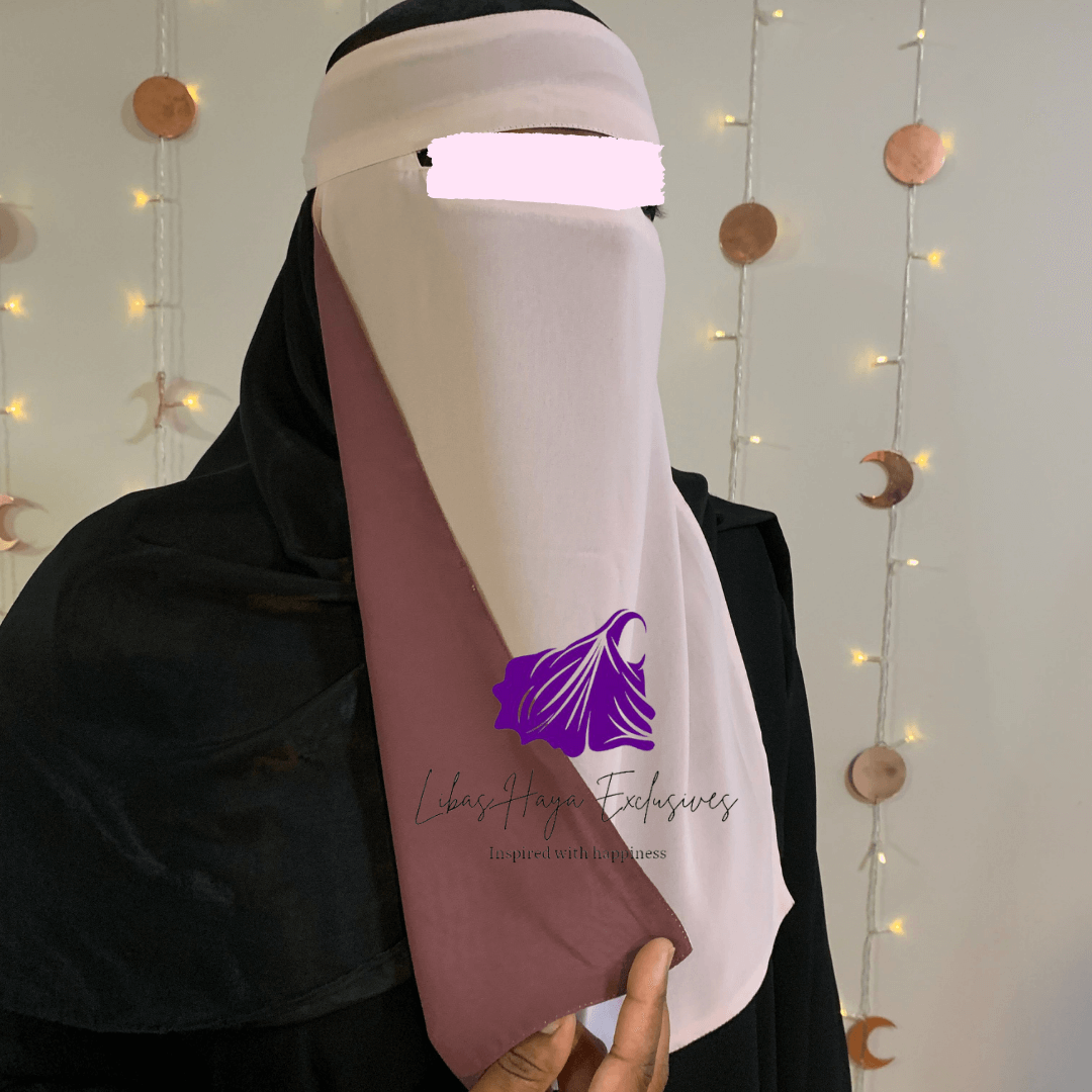 Our Raahah - Single piece Reversible Niqab, you didn't know you needed. Imagine having a niqab that gives you this: Less expense and Two colors, all in one!  This niqab does just that!  With its design being two-in-one, you don't have to buy multiple niqabs to match your outfit. They are super soft, breathable, and lightweight. Each side having a solid color that is not visible on the other, making these a ''Staple piece'' niqab. * This product ships from our Trinidad & Tobago Warehouse.